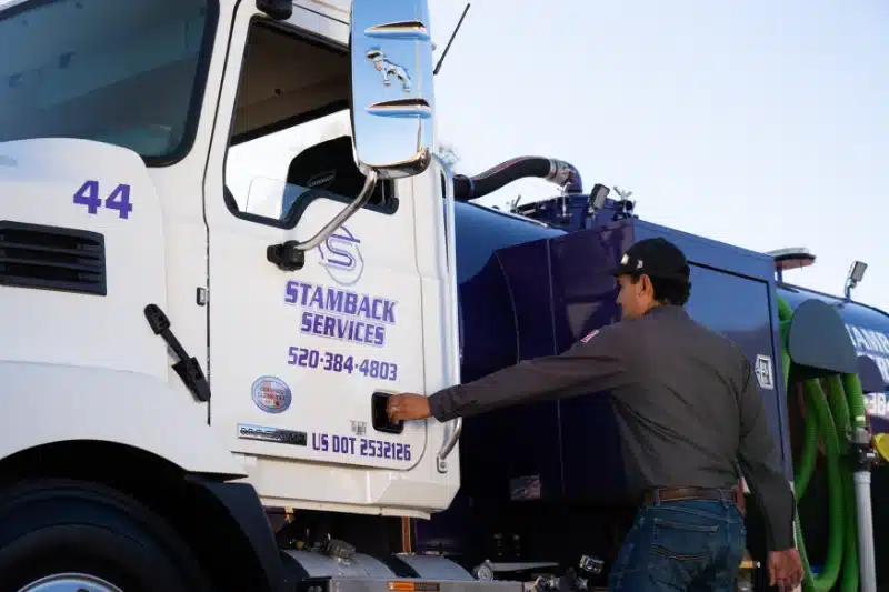 Stamback Services employee getting into a truck